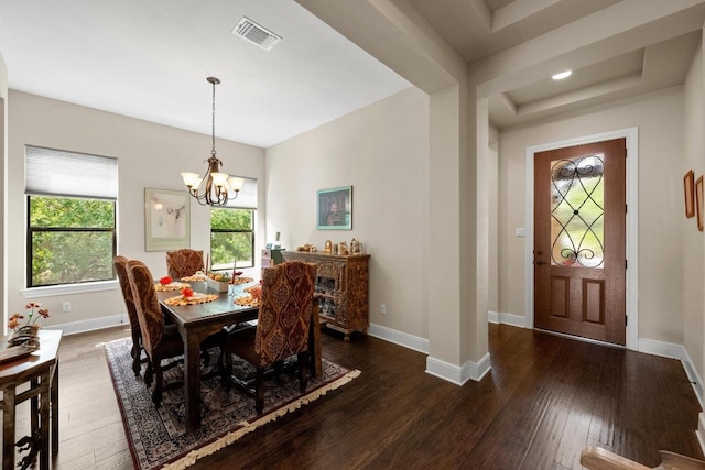 29 Prestonwood Cir, Lakeway, TX 78734 - dining area with a chandelier, hardwood / wood-style flooring, and a tray ceiling