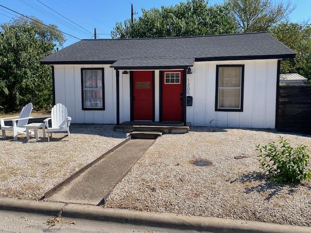 1305 Salina St Unit 1, Austin, TX 78702 - view of front facade featuring board and batten siding and a shingled roof