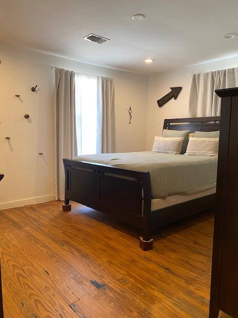 1305 Salina St Unit 1, Austin, TX 78702 - bedroom featuring wood finished floors and baseboards