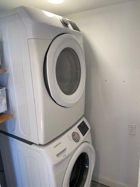 1305 Salina St Unit 1, Austin, TX 78702 - laundry room featuring stacked washer / drying machine and baseboards