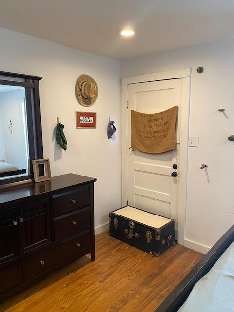 1305 Salina St Unit 1, Austin, TX 78702 - doorway featuring wood finished floors and recessed lighting