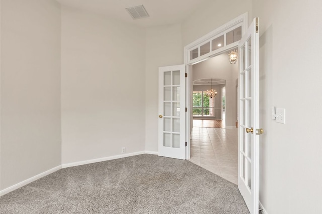 11208 Cedarcliffe Dr, Austin, TX 78750 - carpeted spare room with french doors and a chandelier