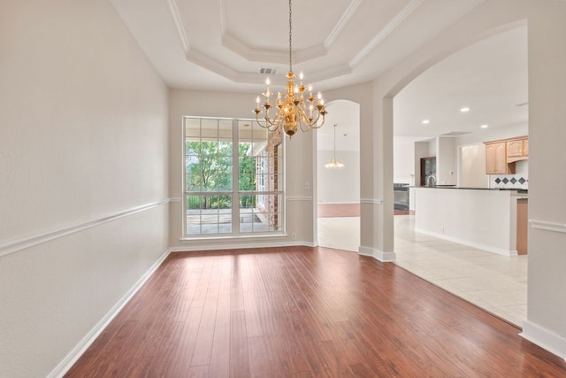 11208 Cedarcliffe Dr, Austin, TX 78750 - spare room featuring a chandelier, a raised ceiling, hardwood / wood-style floors, crown molding, and recessed lighting