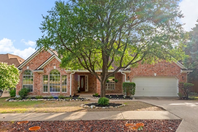 11208 Cedarcliffe Dr, Austin, TX 78750 - view of front of house featuring an attached garage, brick siding, and driveway
