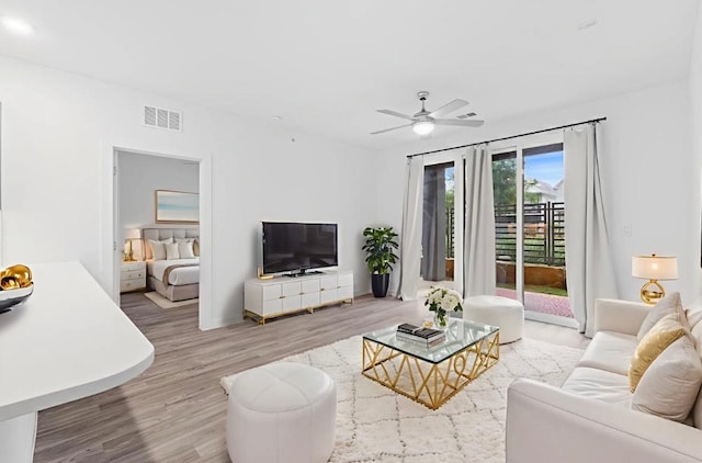 4801 Springdale Dr Unit 2010, Austin, TX 78723 - living area featuring wood finished floors and a ceiling fan