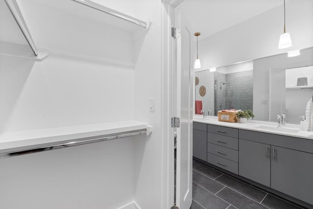 4801 Springdale Dr Unit 2010, Austin, TX 78723 - full bath with double vanity, tile patterned flooring, and a stall shower