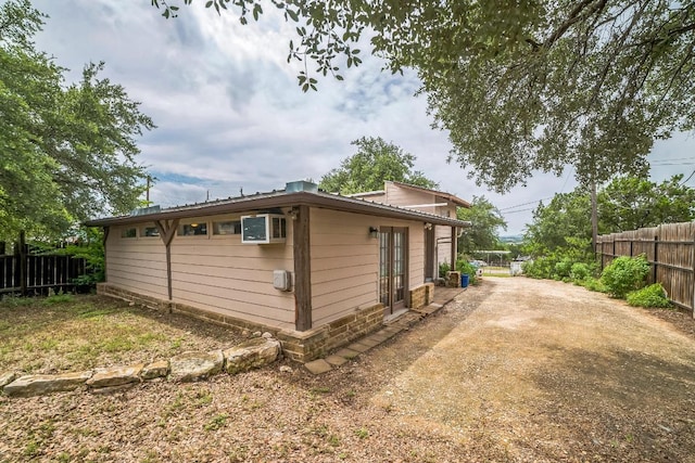 15102 Iowa St, Austin, TX 78734 - view of side of home featuring dirt driveway