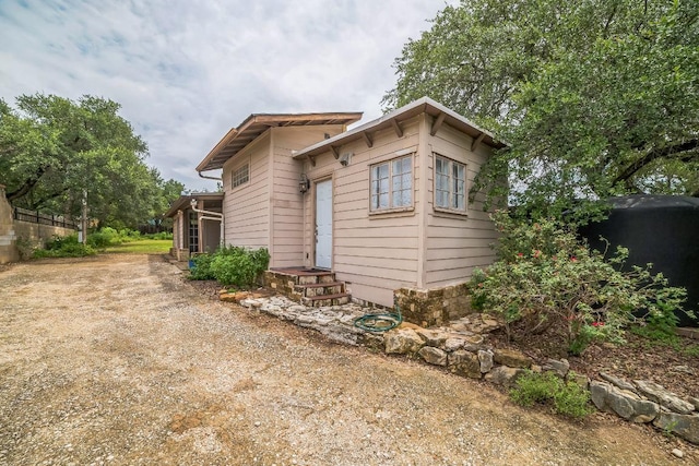 15102 Iowa St, Austin, TX 78734 - view of front of house with dirt driveway