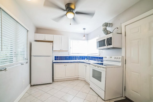 15102 Iowa St, Austin, TX 78734 - kitchen with white appliances, healthy amount of natural light, white cabinets, and a ceiling fan