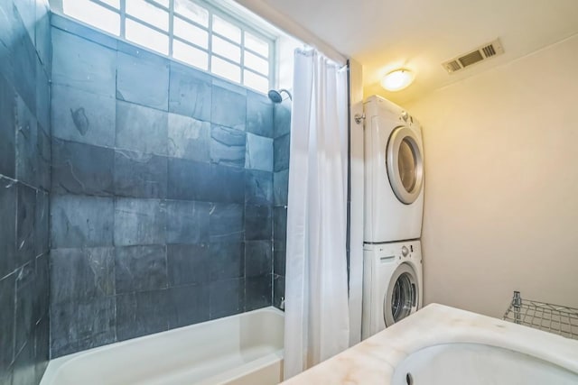 15102 Iowa St, Austin, TX 78734 - full bath with stacked washer / drying machine, shower / bathtub combination with curtain, and vanity