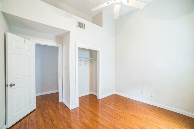 15102 Iowa St, Austin, TX 78734 - unfurnished bedroom with light wood finished floors, a closet, and a ceiling fan