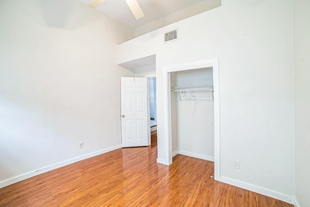 15102 Iowa St, Austin, TX 78734 - unfurnished bedroom with a closet, light wood-style floors, and a ceiling fan