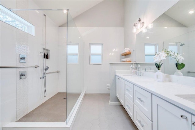 9110 Scotsman Dr, Austin, TX 78750 - full bath featuring lofted ceiling, a walk in shower, double vanity, and tile patterned floors