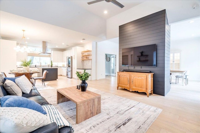 9110 Scotsman Dr, Austin, TX 78750 - living area featuring a ceiling fan, a chandelier, light wood finished floors, and recessed lighting