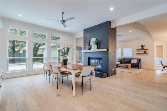9110 Scotsman Dr, Austin, TX 78750 - dining area with a multi sided fireplace, light wood-style floors, ceiling fan, and recessed lighting