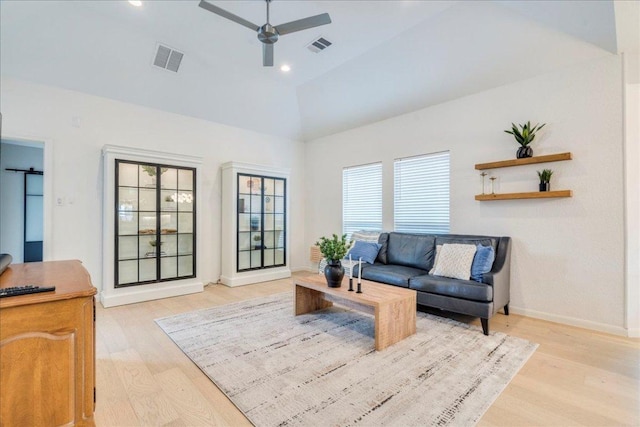 9110 Scotsman Dr, Austin, TX 78750 - living area with light wood-type flooring, ceiling fan, and high vaulted ceiling