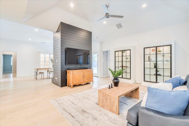 9110 Scotsman Dr, Austin, TX 78750 - living area featuring lofted ceiling, ceiling fan, recessed lighting, and light wood-style floors