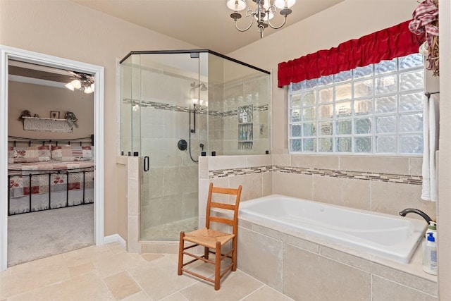 35 Forest Mesa, Round Rock, TX 78664 - bathroom with a bath, a shower stall, and a chandelier