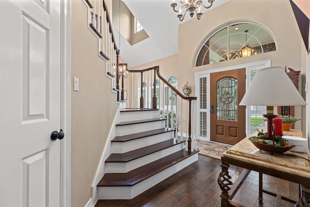 35 Forest Mesa, Round Rock, TX 78664 - foyer entrance with a chandelier, dark wood-style flooring, stairway, and a high ceiling
