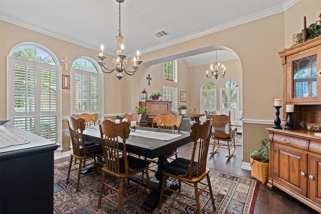 35 Forest Mesa, Round Rock, TX 78664 - dining area with a chandelier, crown molding, and dark wood-type flooring