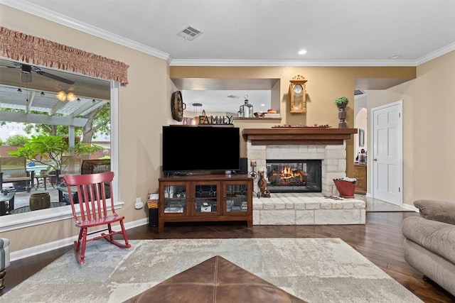 35 Forest Mesa, Round Rock, TX 78664 - living room featuring wood finished floors, ornamental molding, a stone fireplace, and recessed lighting