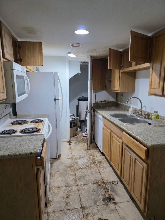 2124 Burton Dr Unit 116, Austin, TX 78741 - kitchen with white appliances, light countertops, and recessed lighting