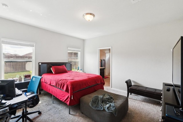 18430 Stevie Ray Dr, Round Rock, TX 78664 - carpeted bedroom featuring an office area and connected bathroom