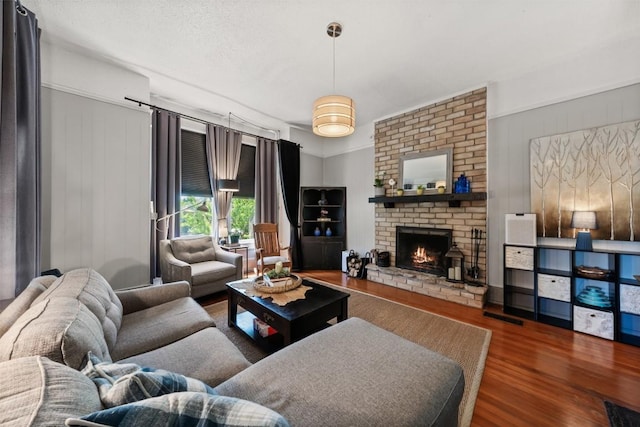 404 E 9th Ave, Belton, TX 76513 - living room featuring wood finished floors and a fireplace