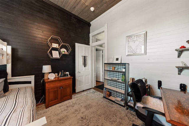 404 E 9th Ave, Belton, TX 76513 - bedroom featuring an office area, wood walls, and wood ceiling