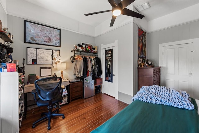 404 E 9th Ave, Belton, TX 76513 - bedroom with hardwood / wood-style floors, a closet, an office area, and a ceiling fan