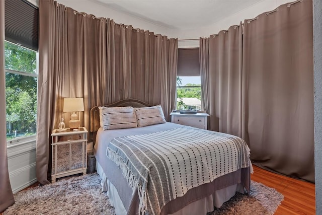 404 E 9th Ave, Belton, TX 76513 - bedroom with multiple windows and wood finished floors