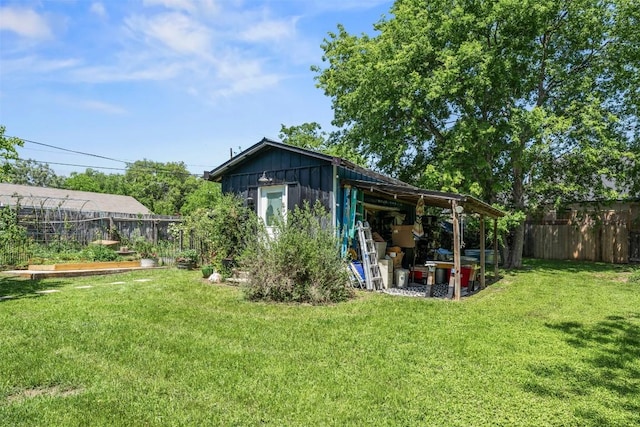 404 E 9th Ave, Belton, TX 76513 - rear view of house featuring a fenced backyard and an outdoor structure