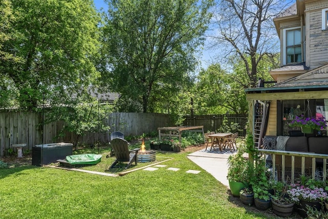 404 E 9th Ave, Belton, TX 76513 - fenced backyard with an outdoor fire pit and a patio area