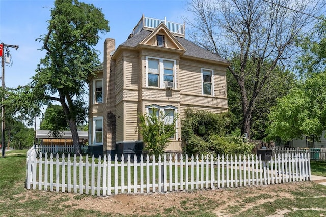 404 E 9th Ave, Belton, TX 76513 - view of side of property with a chimney, a fenced front yard, and cooling unit