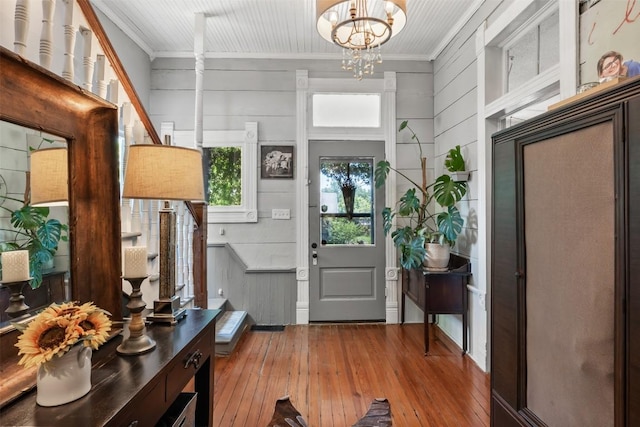 404 E 9th Ave, Belton, TX 76513 - entrance foyer with wood-type flooring, ornamental molding, and a chandelier