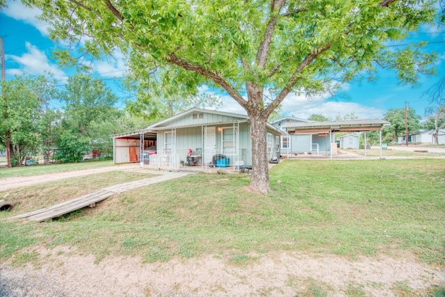 1030 Kingsriver Dr, Granite Shoals, TX 78654 - view of front of home featuring a front lawn and board and batten siding