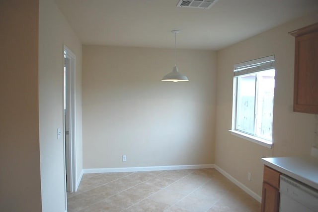 205 E Mitchell Dr, Hutto, TX 78634 - unfurnished dining area with light tile patterned flooring and baseboards