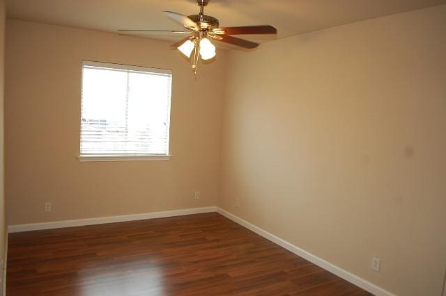 205 E Mitchell Dr, Hutto, TX 78634 - unfurnished room featuring ceiling fan and dark wood-style flooring
