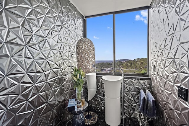1501 Ridgecrest Dr, Austin, TX 78746 - bathroom featuring a soaking tub and a wall of windows