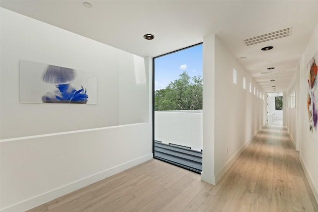 1501 Ridgecrest Dr, Austin, TX 78746 - hallway with light wood-style flooring and baseboards