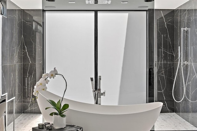 1501 Ridgecrest Dr, Austin, TX 78746 - bathroom featuring a freestanding bath and a marble finish shower