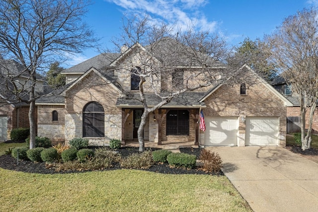 1116 Castle Path, Round Rock, TX 78681 - traditional-style house featuring concrete driveway, a front lawn, a garage, roof with shingles, and stone siding