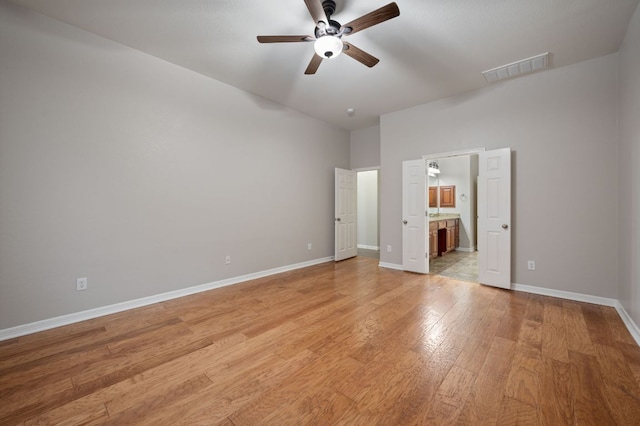 1116 Castle Path, Round Rock, TX 78681 - unfurnished bedroom featuring light wood-style floors, ensuite bath, and a ceiling fan