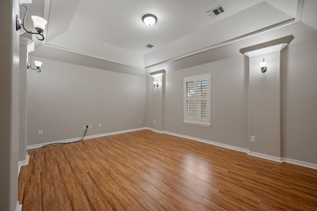 1116 Castle Path, Round Rock, TX 78681 - spare room with wood finished floors and a tray ceiling