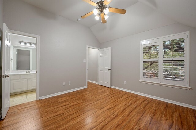 1116 Castle Path, Round Rock, TX 78681 - unfurnished bedroom with lofted ceiling, light wood-style flooring, ensuite bathroom, and ceiling fan
