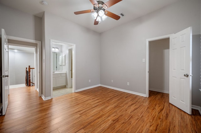 1116 Castle Path, Round Rock, TX 78681 - unfurnished bedroom with light wood-style floors, ensuite bath, and a ceiling fan