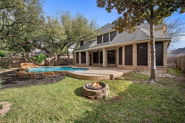 1116 Castle Path, Round Rock, TX 78681 - rear view of property featuring an outdoor fire pit, roof with shingles, a fenced backyard, a patio area, and brick siding