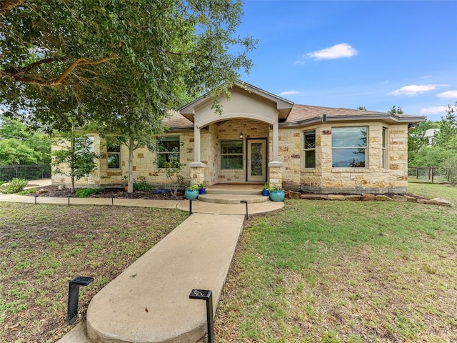 167 Manawianui Dr, Bastrop, TX 78602 - single story home with stone siding and roof with shingles