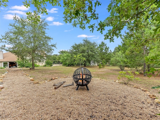 167 Manawianui Dr, Bastrop, TX 78602 - view of yard featuring an outdoor fire pit
