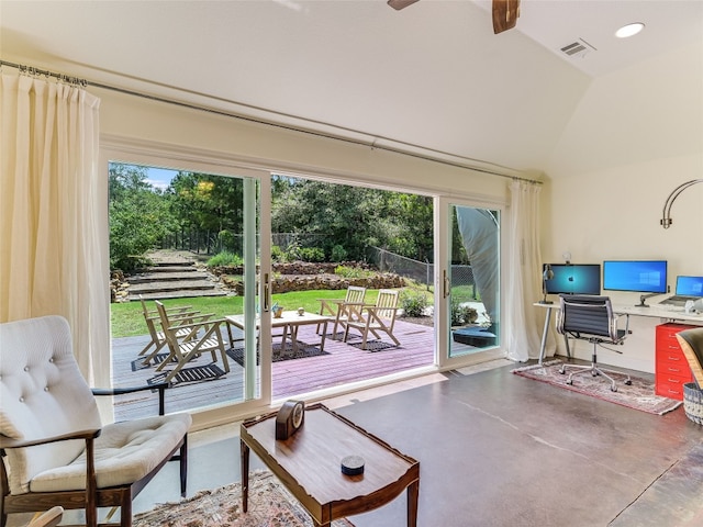 167 Manawianui Dr, Bastrop, TX 78602 - living room featuring concrete flooring, healthy amount of natural light, a ceiling fan, lofted ceiling, and an office area